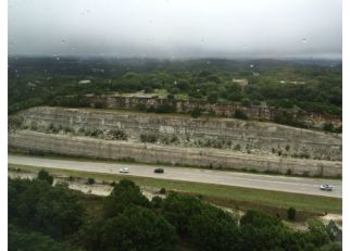 >Image credit: Rainswept vista of Austin, Texas, from Dimensional Fund Advisors' headquarters (Jason Zweig, 2016)